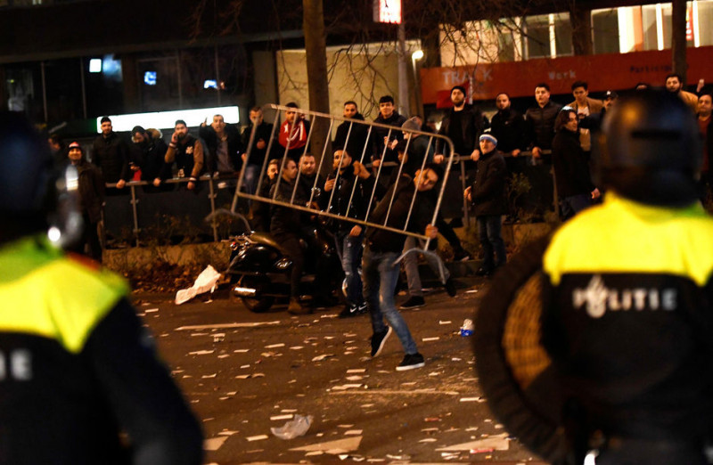 Second night of Netherlands violence as Biden touts herd immunity
