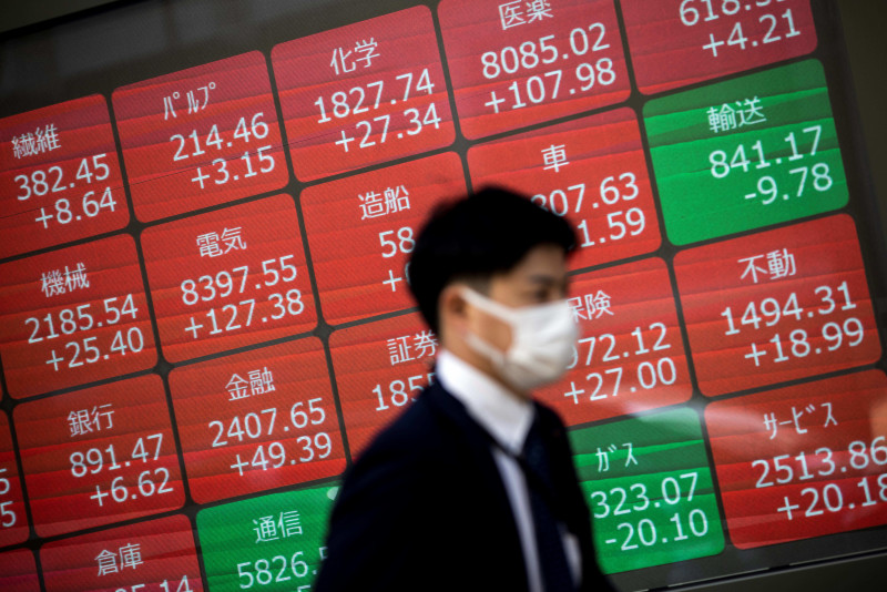 Asian markets fall with Wall St after Fed rate hike, warning