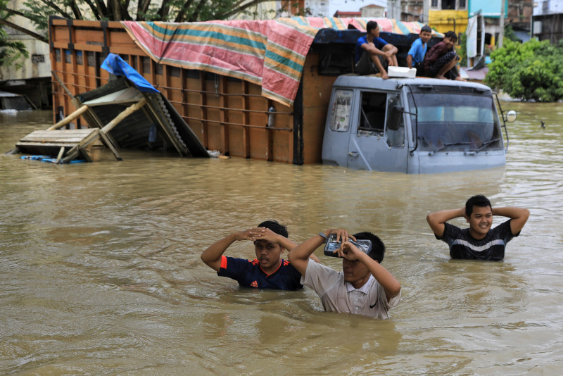 Indonesian floods kill two, force 24,000 to evacuate