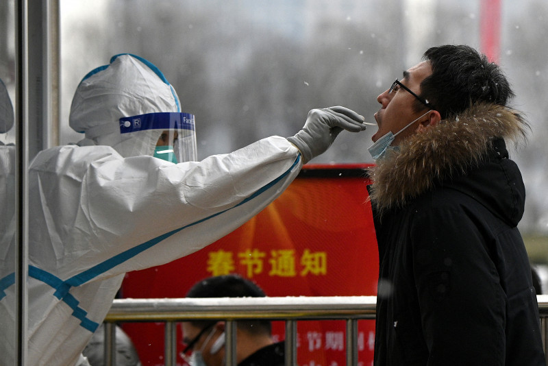 Beijing tightens Covid-19 restrictions as long holiday begins