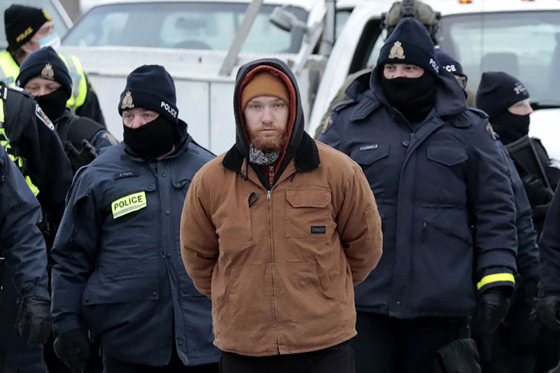 Canada police clear key border bridge as protests still cripple Ottawa