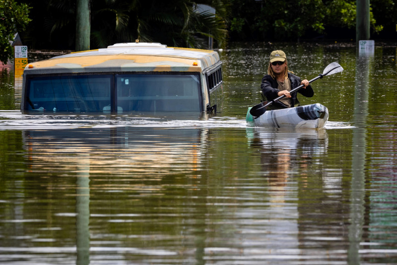 Australians continue to flee floods, death toll rises to 12