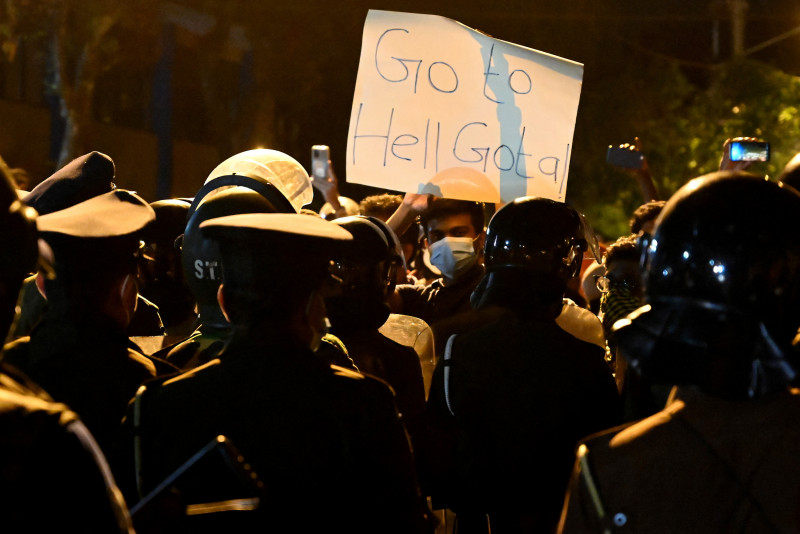 Sri Lanka leader offers to share power as protests mount