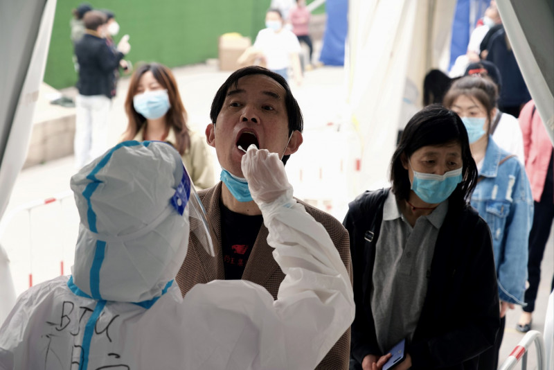 Beijing Covid-19 spike prompts mass testing, panic buying