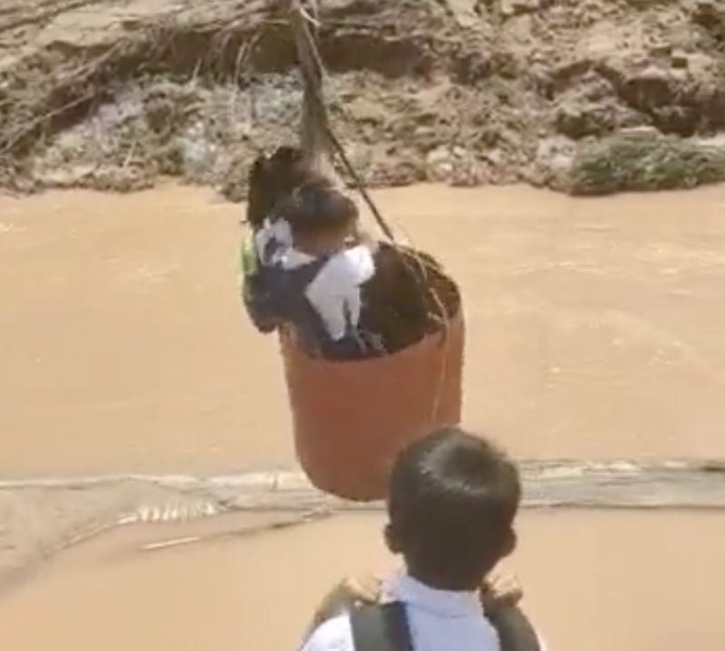 Tempting fate, Sabah kids zipline across river to go to school