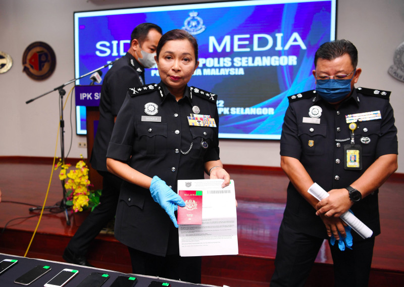 Police nab two men for duping M’sians into joining scam syndicate