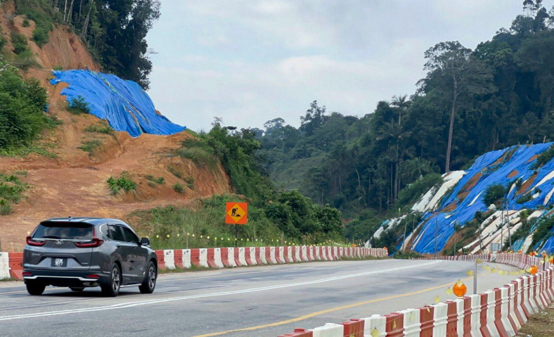 Gua Musang-Kuala Krai road users fear canvas on slopes may collapse