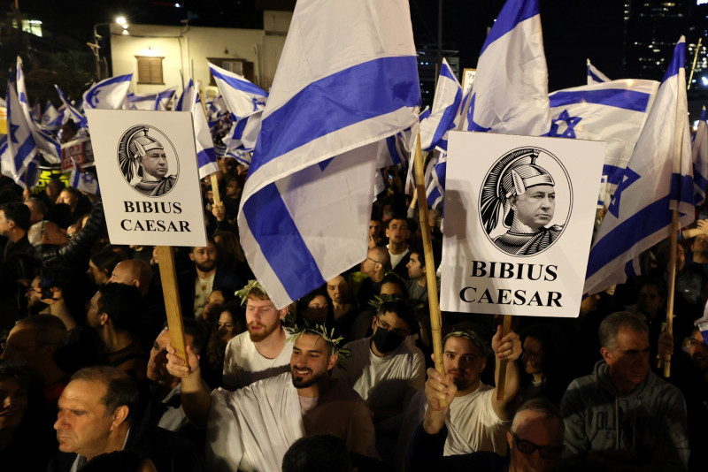 Former Israel PM joins mass rally against hard-right govt