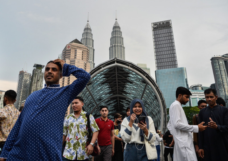 Quiet malls a respite for migrant workers during Raya