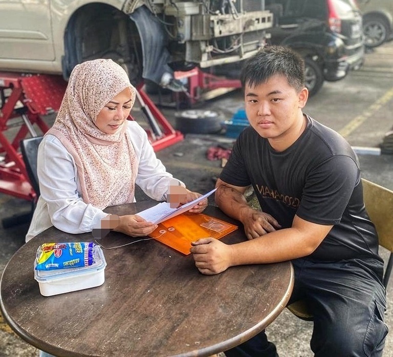 Malay-owned car workshop wins praise after taking in Chinese intern