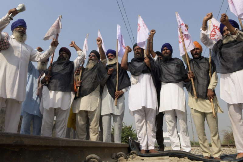 India PM defends farm reforms as protests grow