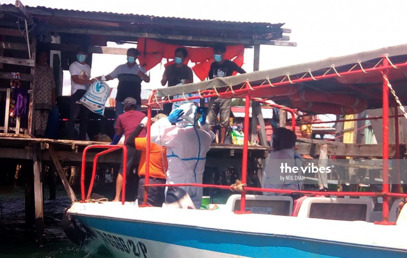 Another man’s treasure: Gaya islanders trade 400 bags of rubbish for food