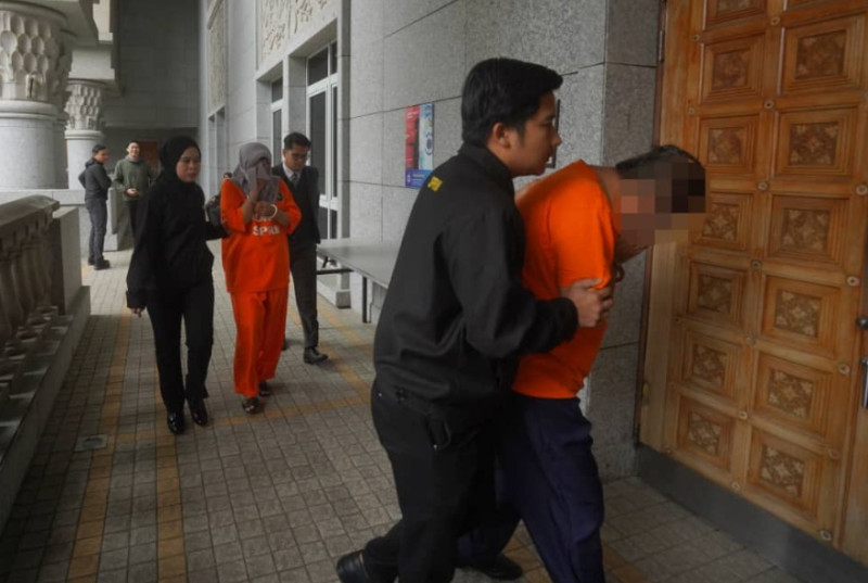 Former political secretary, wife arrive in court for remand application