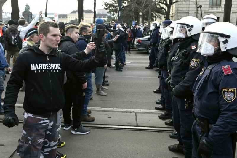Austrians defy ban to protest virus restrictions