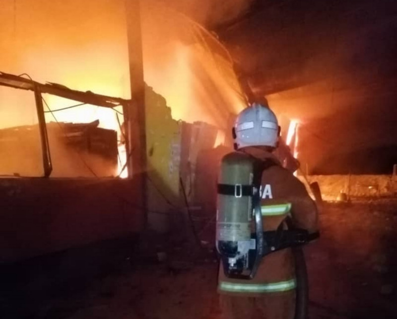 Woman trapped in Sarawak mini mart blaze dies