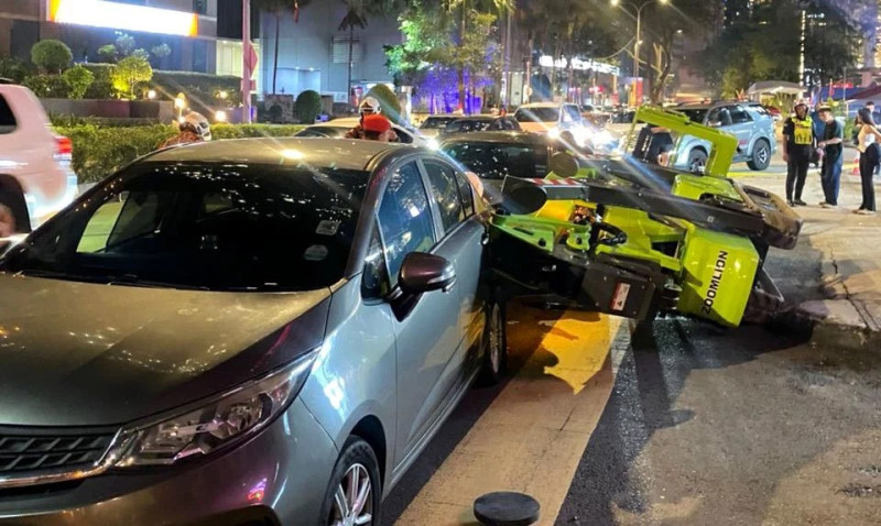 Foreign worker dies after spider lift crane topples in Kuala Lumpur
