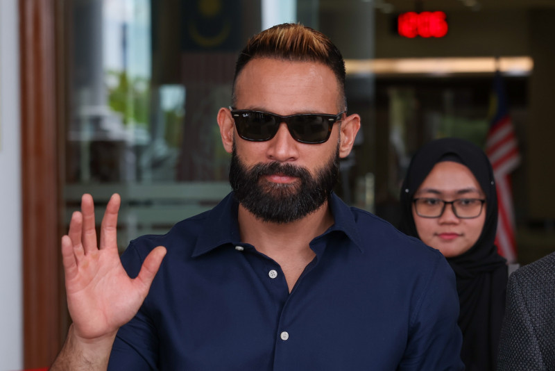 Actor Sharnaaz Ahmad pleads not guilty to hurting condo security guard