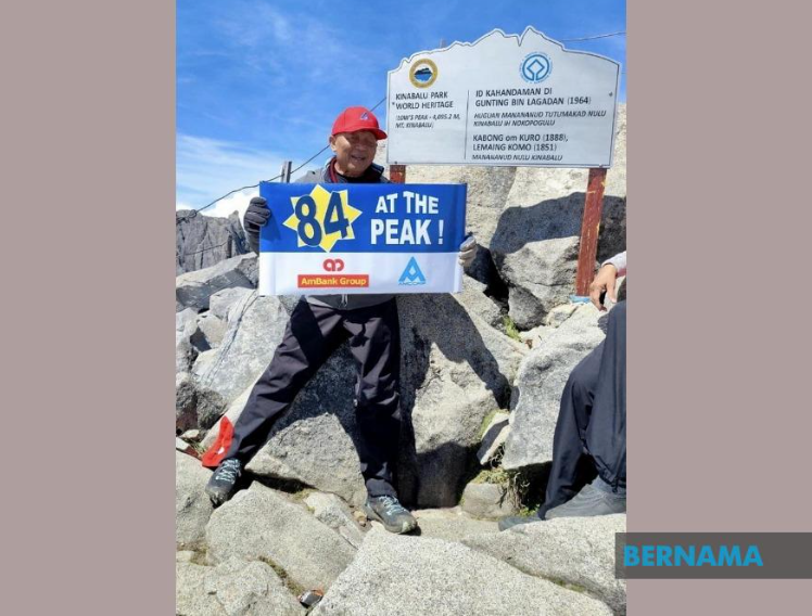 Banking icon Azman Hashim climbs to Mount Kinabalu summit at age 84