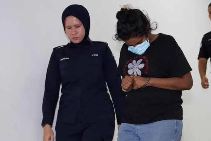 Housewife pleads not guilty to possessing 205 passports and fake MyKad