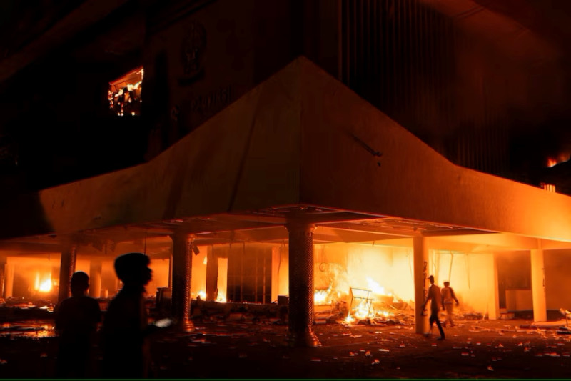 Three dead as Indonesian protesters set fire to regional parliament building