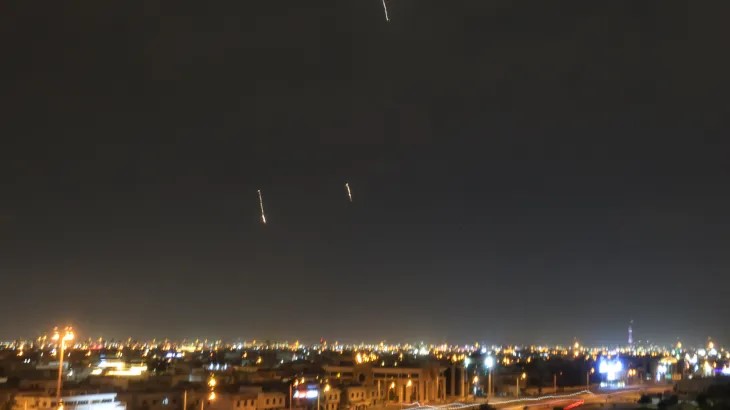 Rocket strike on Baghdad airport injures five as Iran warns Gulf states amid widening conflict