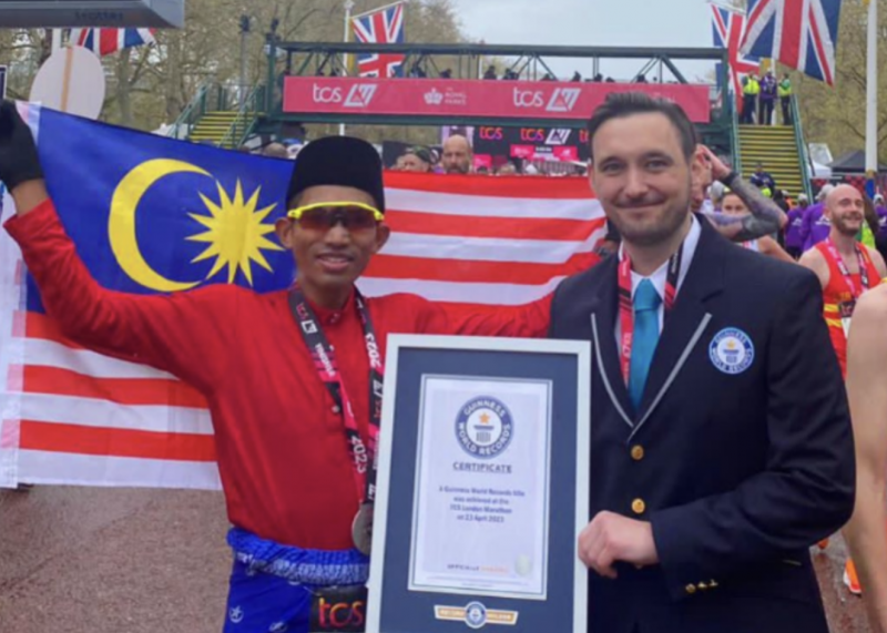 National runner sets Guinness World Record for fastest marathon in traditional attire