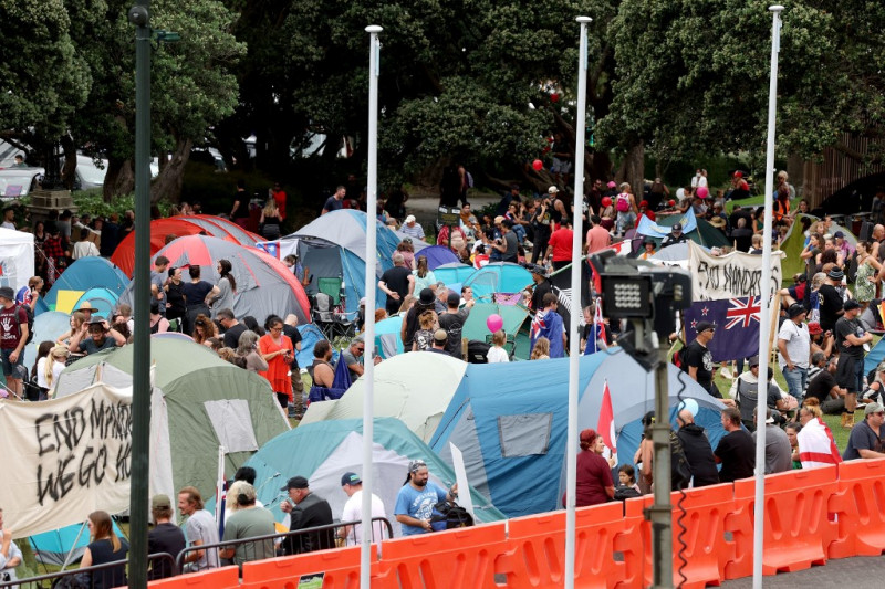 New Zealand Covid-19 protest grows after cops draw back