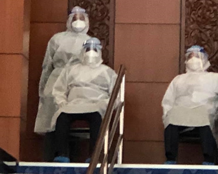Opposition stages walkout after 3 MPs in protective gear allowed to vote