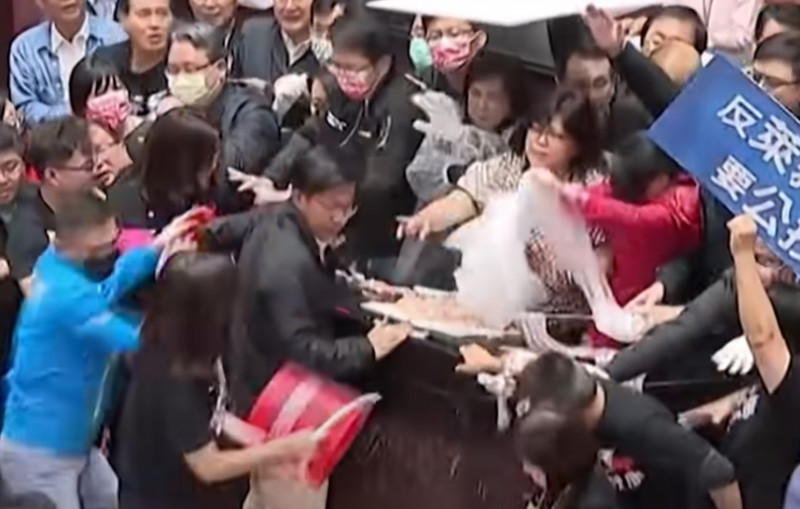 Pig guts fly in Taiwan parliament protest