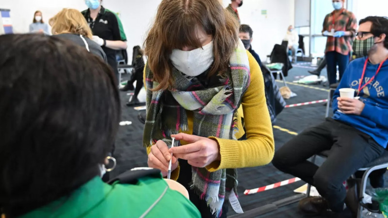 UK trains volunteer vaccine army in inoculation race