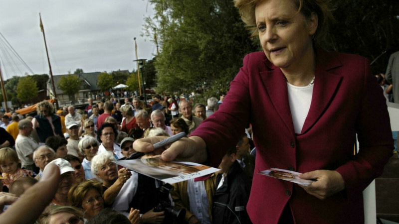 From football fan to Trump tamer: Merkel in photos