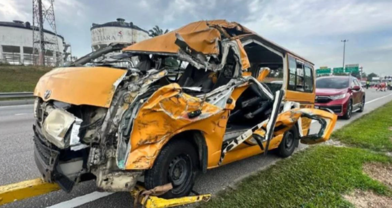 School van crashes into rear of trailer which stopped due to engine problems