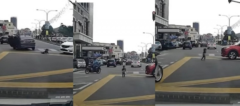 Child falls out as car makes U-turn at busy intersection 