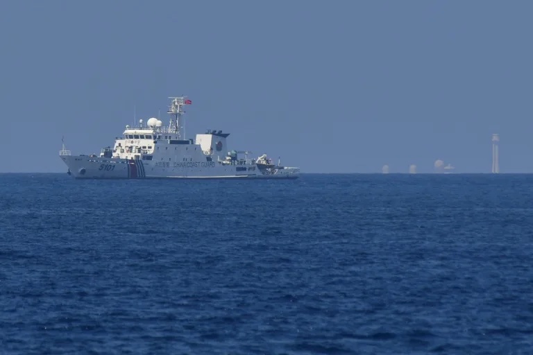 China says Philippine boat’s ‘provocative action’ caused near-crash