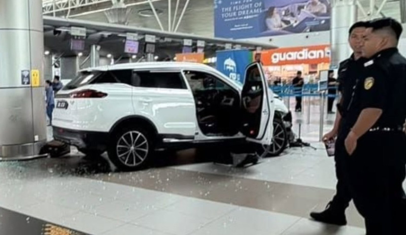 SUV crashes into KKIA departure hall entrance, female driver injured