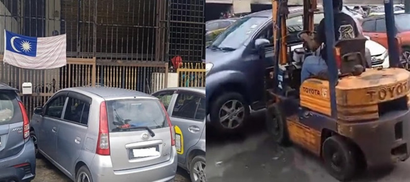Unable to open his workshop, man uses forklift to remove parked cars