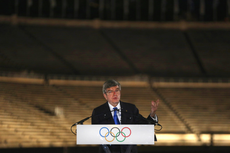 Olympic chief's Japan visit postponed as virus cases surge