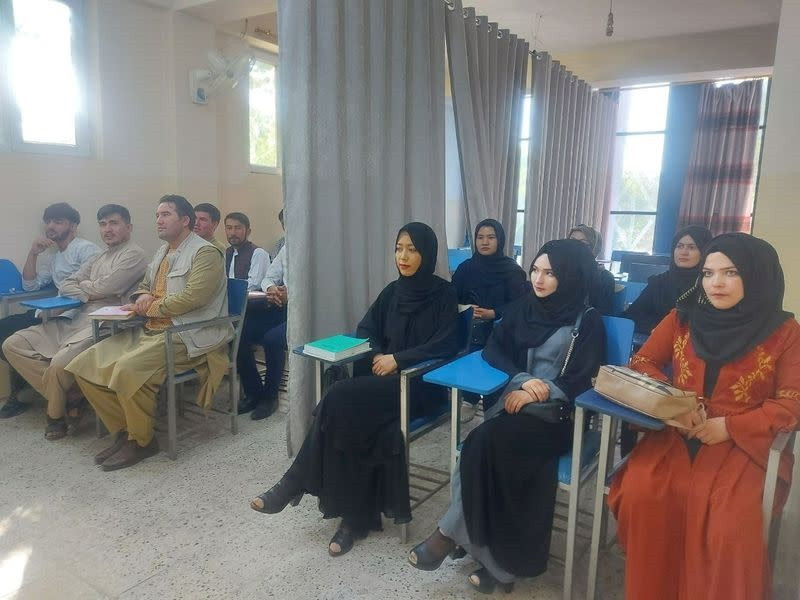A curtain divides men, women as Afghan universities reopen