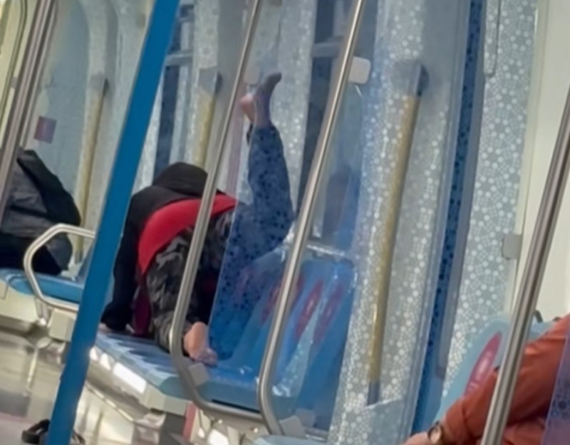 Woman casually does her 'morning workout' on MRT seat in ladies' coach