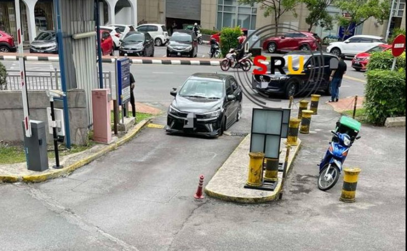 ‘Super low’ Bezza gets stuck on speed bump at entrance to bank car park