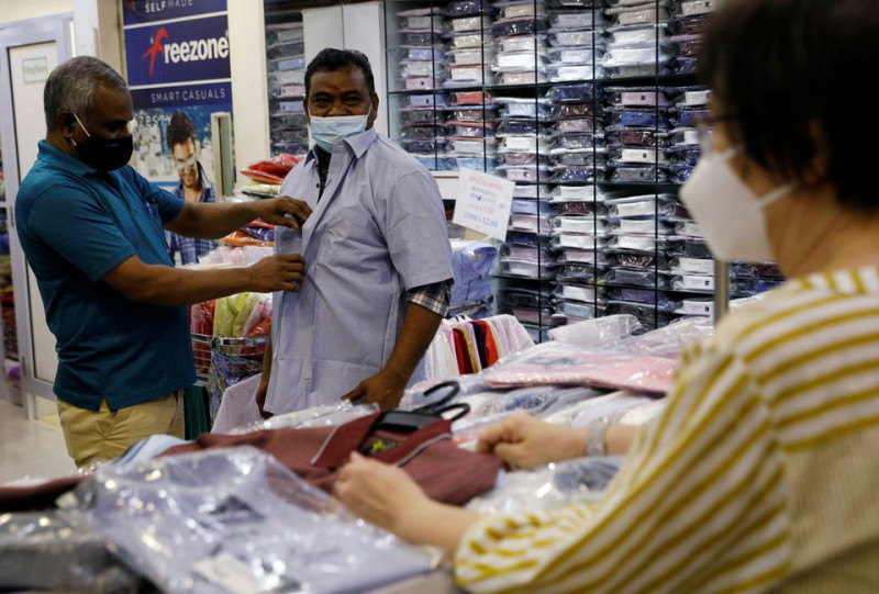 Migrants get taste of freedom as Singapore loosens labour curbs