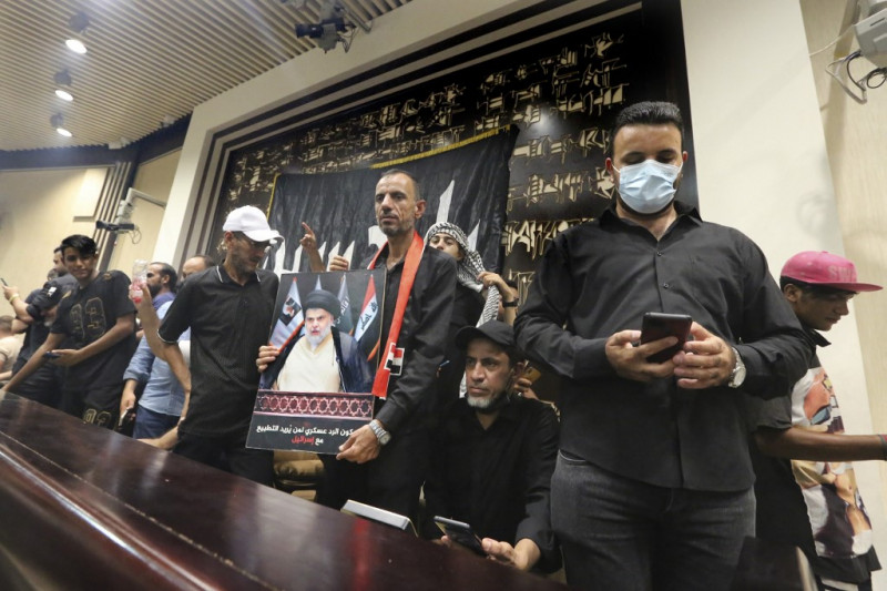 Iraqi cleric urges wider protests as supporters occupy parliament