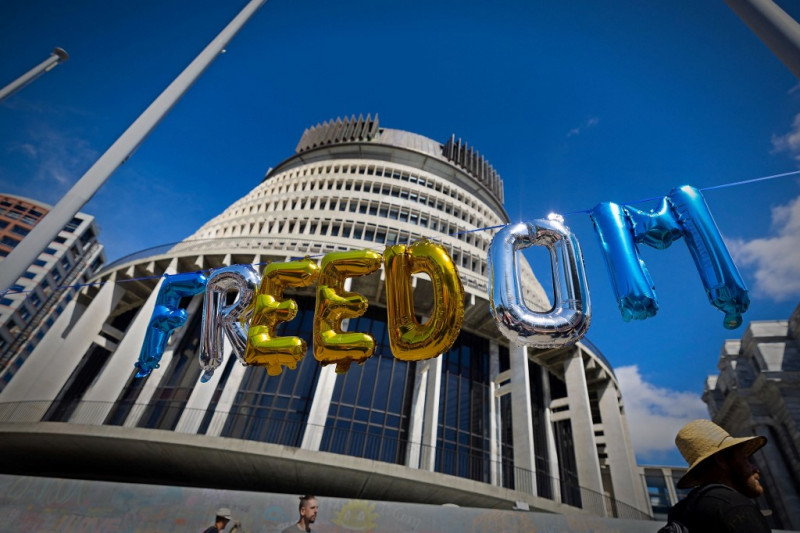 New Zealand virus cases spike as anti-vaccine protesters claim win