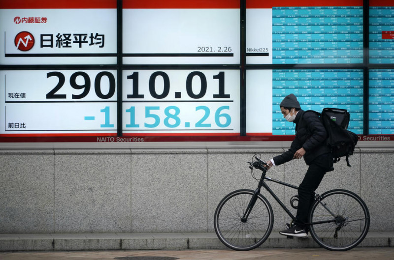 Tokyo shares open down ahead of corporate results