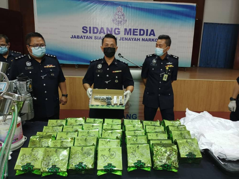 Cops seize gun, RM3.5 mil in drugs from Penang shophouse