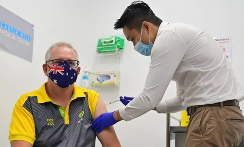 Australia administers first Covid-19 vaccines