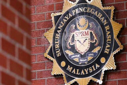 Two officers claim trial to bribery charges